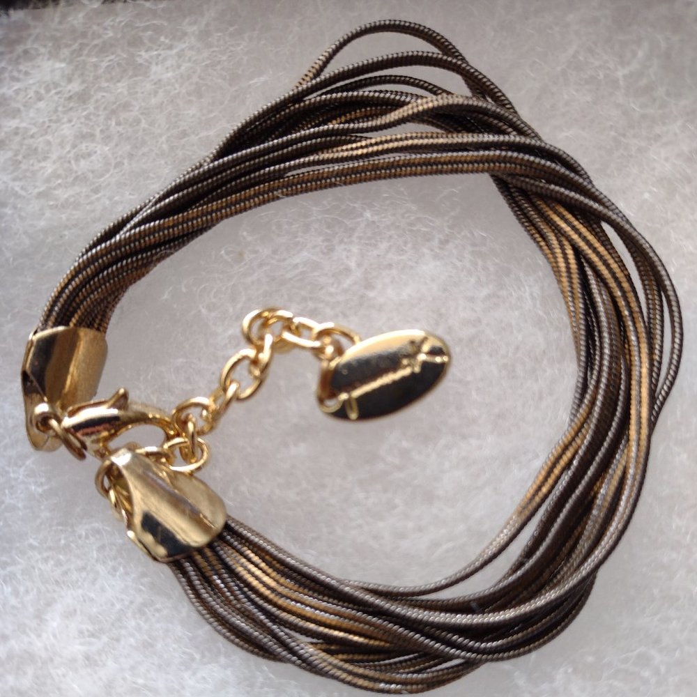 Multi-chained dark bronze-toned bracelet with gold-toned closures and 10 chains.